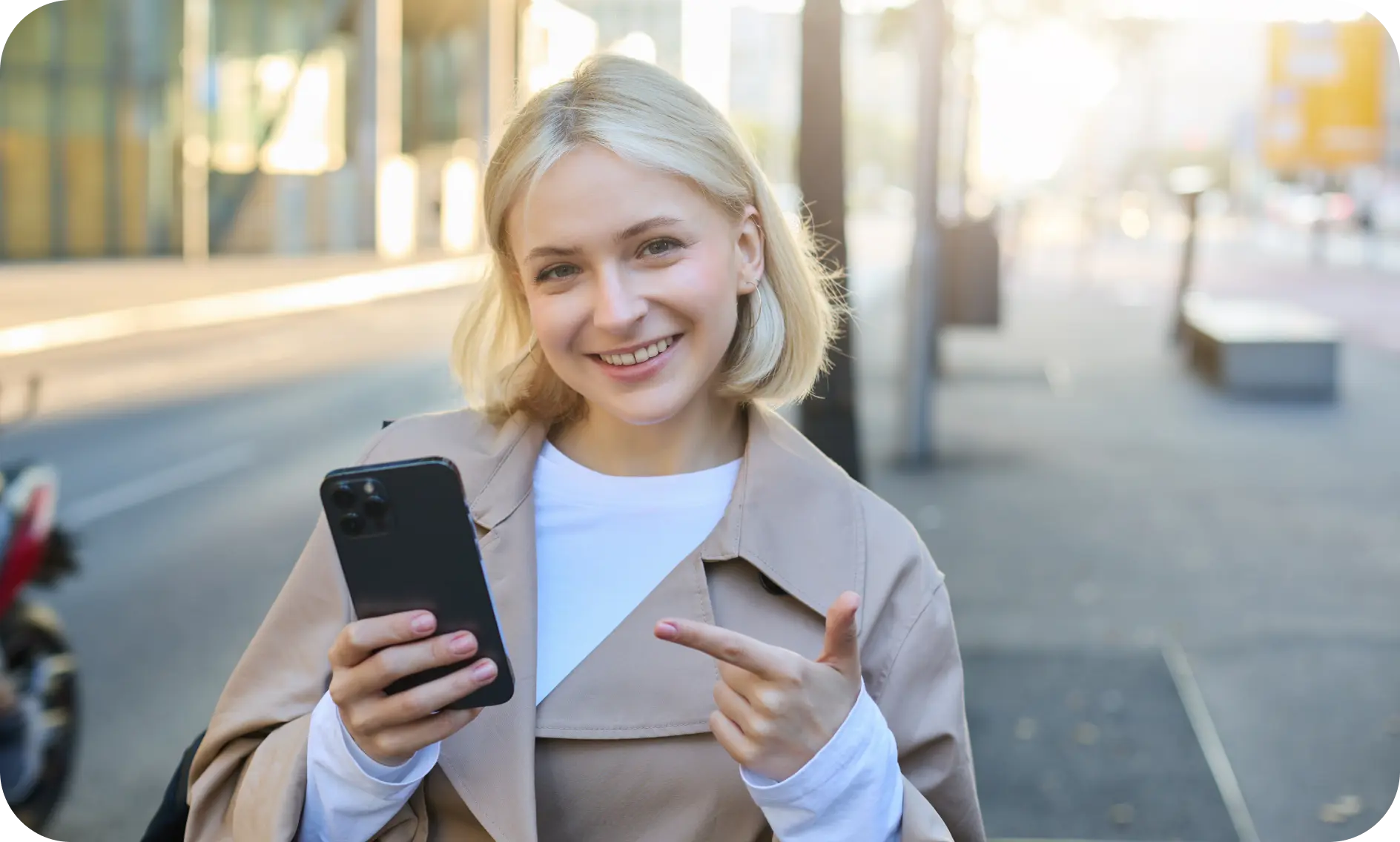 Smiling girl with a phone in her hands