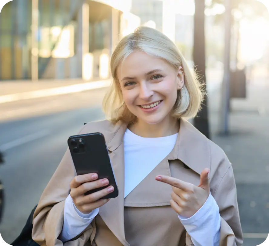 Smiling girl with a phone in her hands